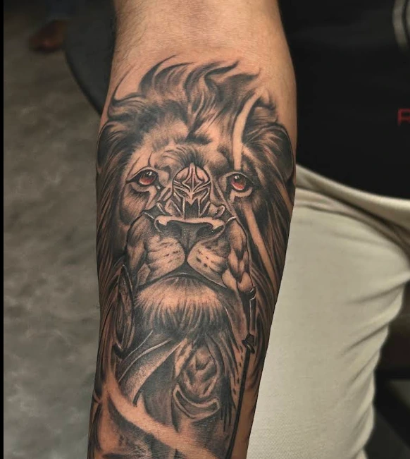 Detailed lion tattoo by Roshni Tattoos