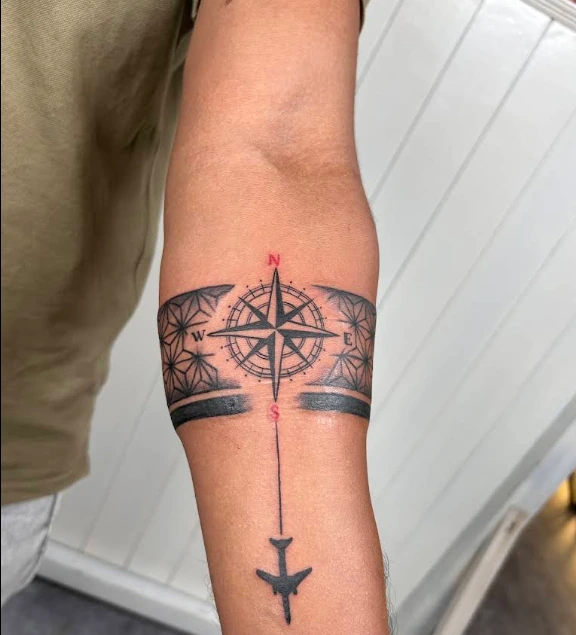 Compass band tattoo